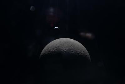 Moon and Earthrise through the Orion window